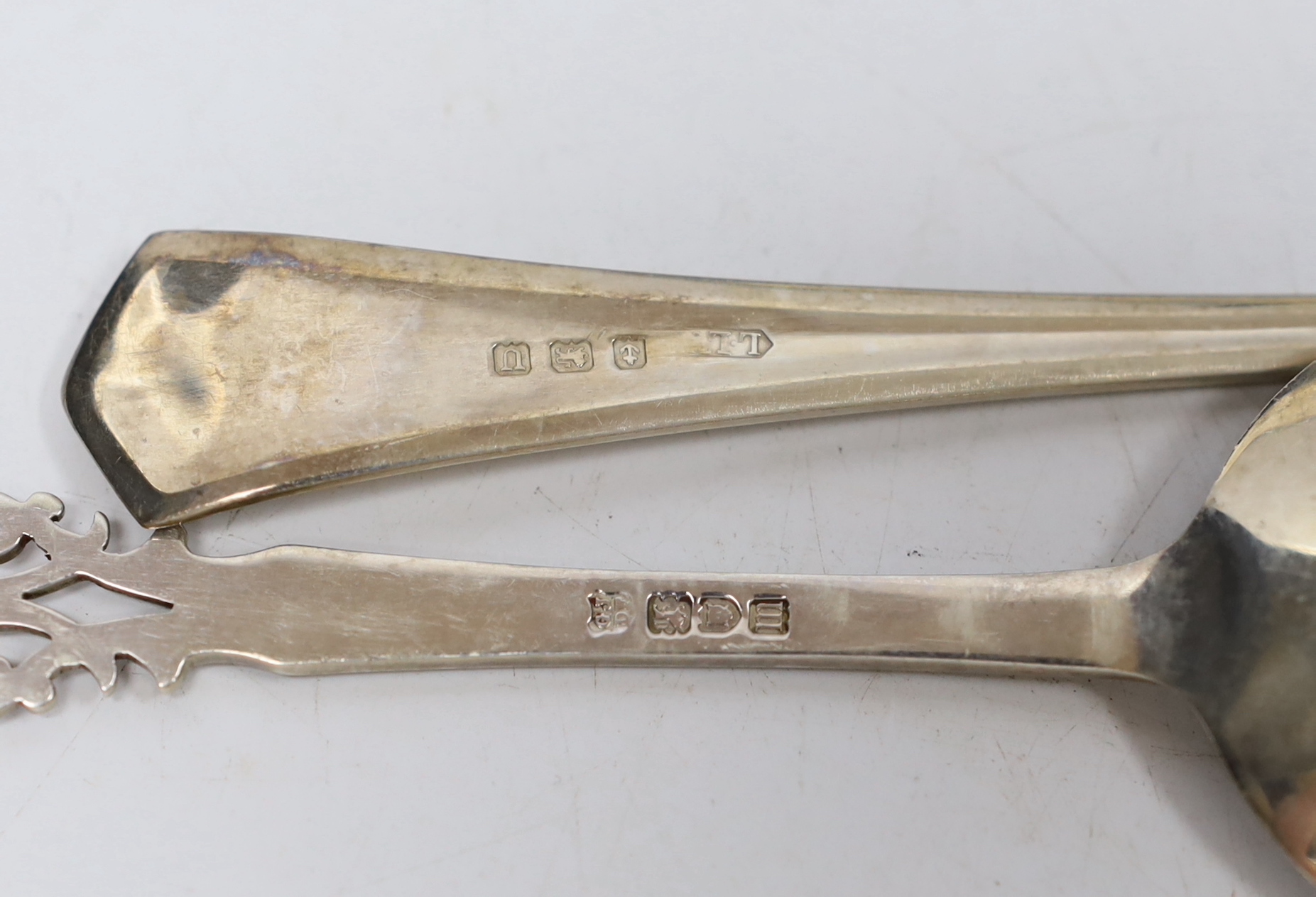 A cased pair of Edwardian silver serving spoons with pierced terminals, Josiah Williams & Co, London, 1907, 17.9cm and one other cased pair of silver servers.